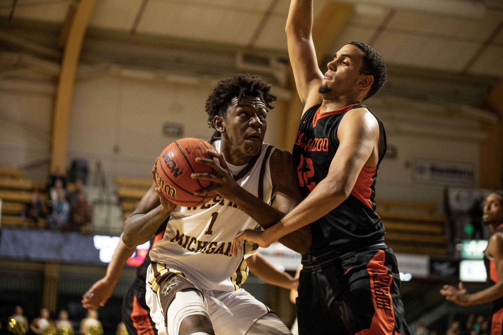 Freshman Chase Barrs goes up on a Kalamazoo College defender.